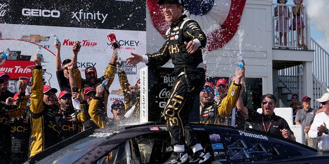 Tyler Reddick held off Chase Elliott to win the Road America NASCAR Cup Series race.