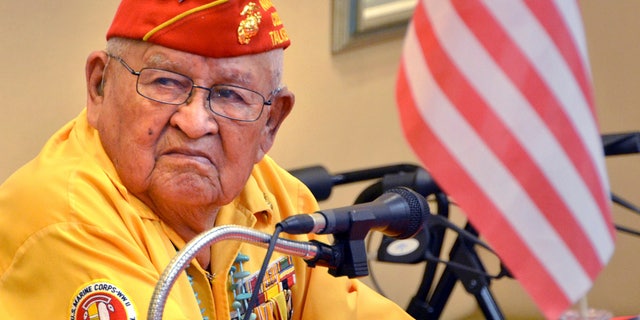 FILE - In this 2013 photo, Navajo Code Talker Samuel Sandoval talks about his experiences in the military in Cortez, Colo. Sandoval, one of the last remaining Navajo Code Talkers who transmitted messages in World War II using a code based on their native language, has died at age 98. Sandoval died late Friday, July 29, 2022, at a hospital in Shiprock, N.M., his wife, Malula told The Associated Press on Saturday. (Sam Green/The Cortez Journal via AP)