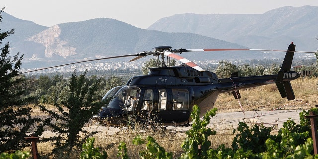 Tape the rear end of the Bell 407 Helicopter Superior Air Helipad in Spata near Athens. A British man died when a helicopter propeller hit him after landing. 