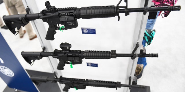 Legal Experts Discuss Whether Parents of Alleged Highland Park Gunman Could Face Charges 2 Smith & Wesson M&P-15 semi-automatic rifles of the AR-15 style are displayed during the National Rifle Association annual meeting at the George R. Brown Convention Center, in Houston, Texas on May 28, 2022.