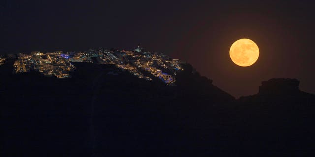 If you missed last month's strawberry supermoon, seen here on June 14 rising over the village of Imerovigli on Sandorini's caldera, in Greece's Cyclades islands, you can spot it again on Wednesday, July 13.