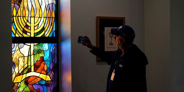 A stained glass window that once had bullet holes is now repaired at Congregation Beth Israel in Colleyville, Texas, Thursday, April 7, 2022. In January, four were taken hostage by a pistol-wielding man during a Shabbat service. 