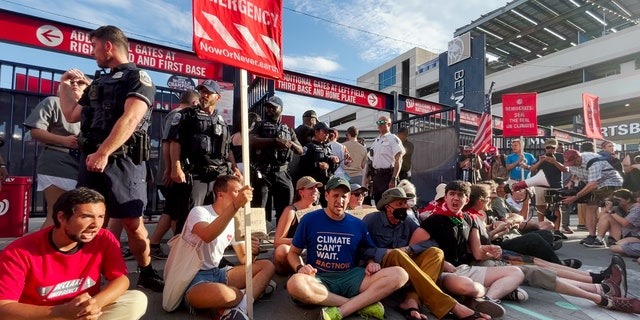 Climate activists block an entrance to Nationals Park during the Congressional Baseball Game.
