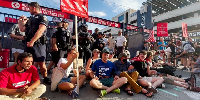 Climate activists block an entrance to Nationals Park during the Congressional Baseball Game.