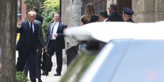 Donald Trump waves as he arrives for Ivana Trump's funeral on July 20, 2022.