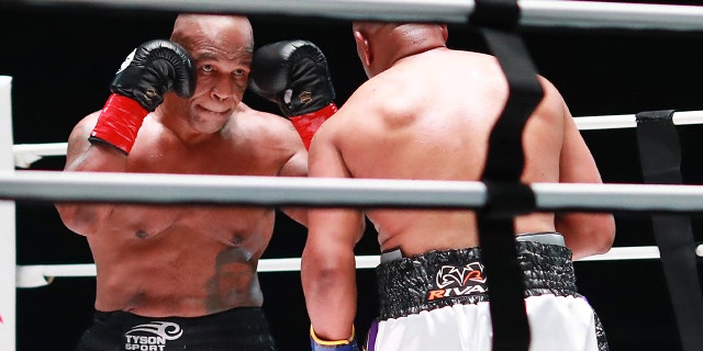 Mike Tyson and Roy Jones Jr. spar off in the fifth round during Mike Tyson vs Roy Jones Jr. presented by Triller at Staples Center on Nov. 28, 2020 in Los Angeles.
