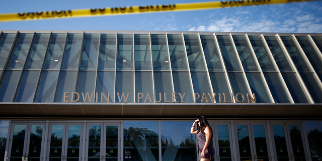 A woman walks past sandbags outside Pauley Pavilion on the UCLA campus in the Westwood section of Los Angeles July 30, 2014. (REUTERS/Lucy Nicholson)