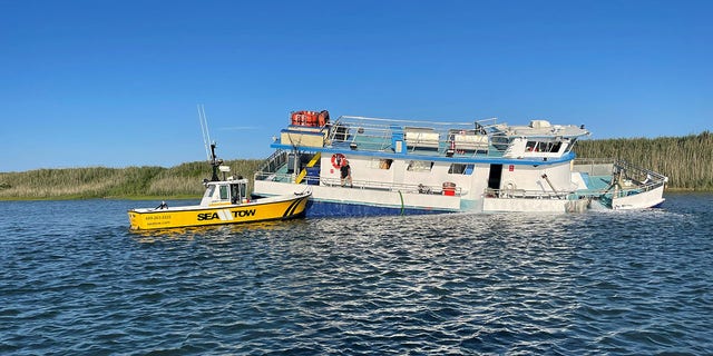 A Good Samaritan helped all 22 people aboard the sinking vessel to a dock in Sea Isle City, New Jersey.