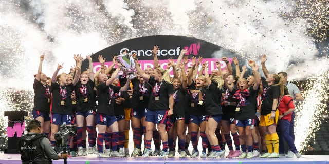 The USWNT celebrate winning the Concacaf W Championship after a Concacaf W Championship game between Canada and USWNT at Estadio BBVA on July 18, 2022 in Monterrey, Mexico.