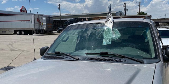 A metal object crashed through the windshield of a vehicle on I-25 in Salt Lake City on Wednesday.