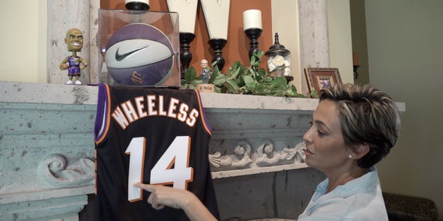 Wheeless shows off Phoenix Suns memorabilia from her time with the NBA team.