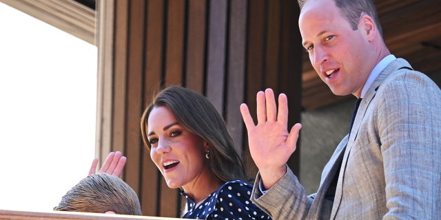 Kate, Duchess of Cambridge, Prince William, Duke of Cambridge attend The Wimbledon Men's Singles Final at the All England Lawn Tennis and Croquet Club with Prince George (whose head can just barely be seen) on July 10, 2022 in London, England.