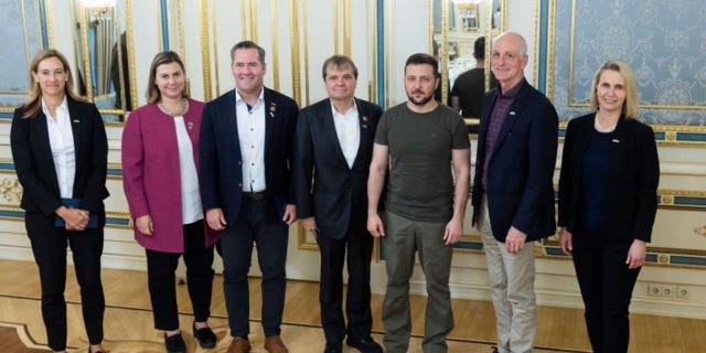 Ukrainian President Volodymyr Zelenskyy with U.S. lawmakers in Kyiv.