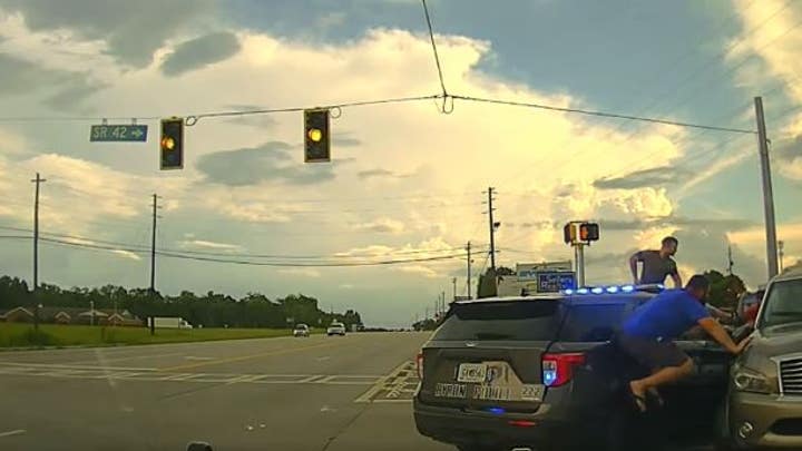 Georgia driver rams patrol cars during traffic stop in wild dashcam video