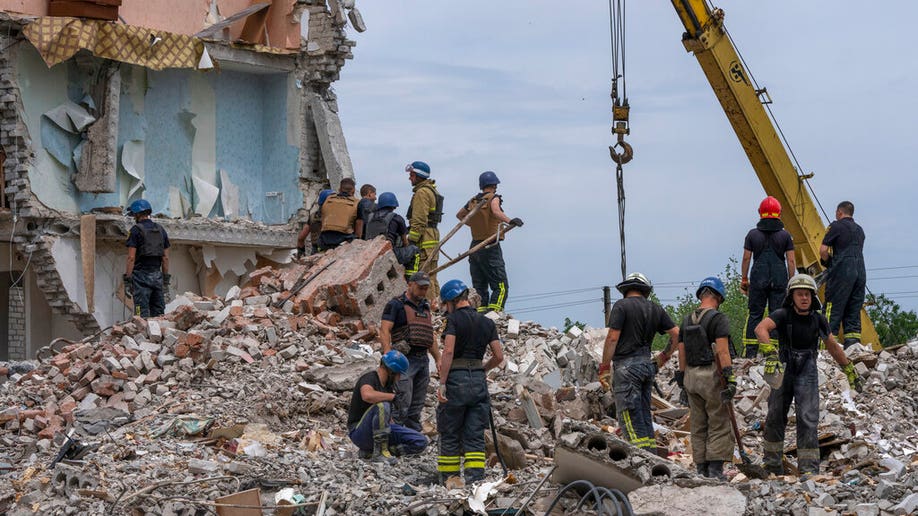 Ukraine apartment rescue teams rubble