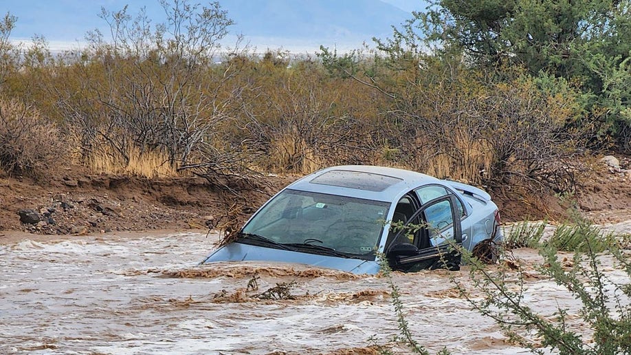 car submerged in floodwater