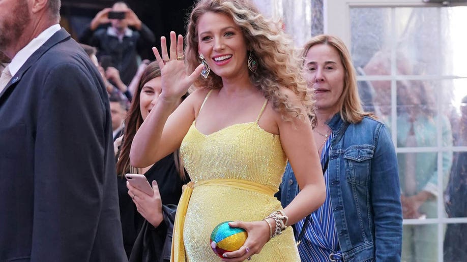 Pregnant, Blake Lively greets the camera.
