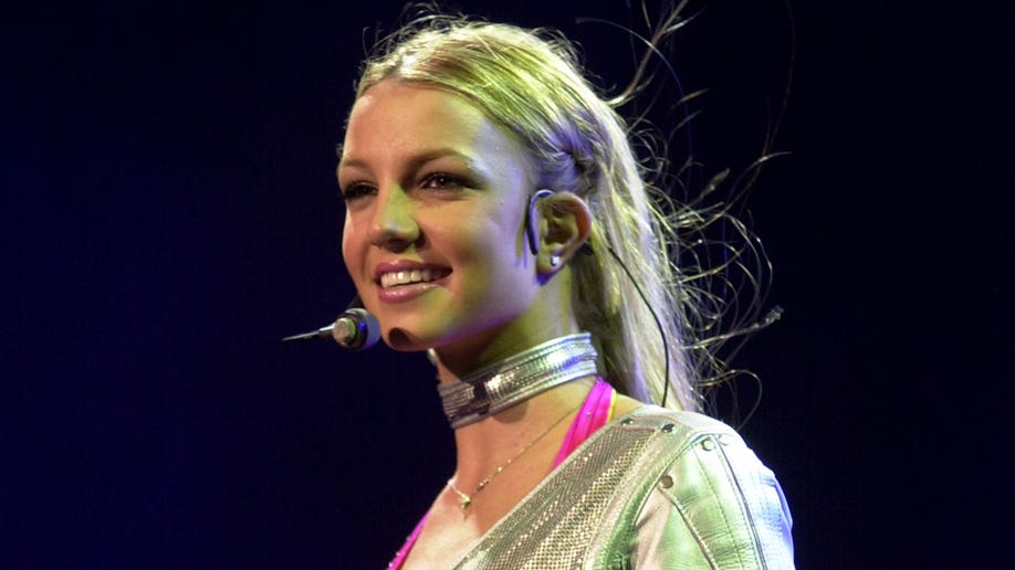 Young Britney Spears performing "Oops I Did it Again" in 2000