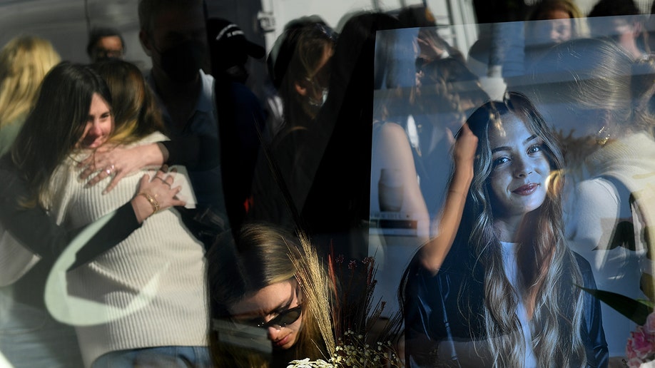 Mourners outside the Croft House store