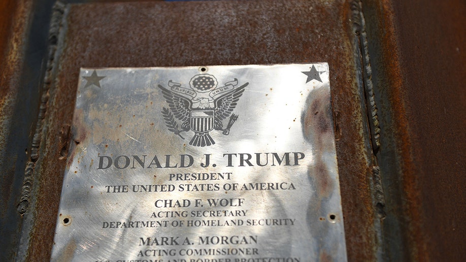 A close up photo of a plaque with Donald Trump's name