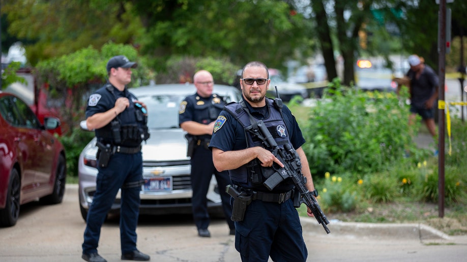 Armed police respond to Mass shooting at a Fourth of July parade
