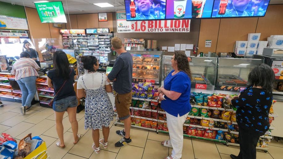 People wait in line to buy their lottery ticket