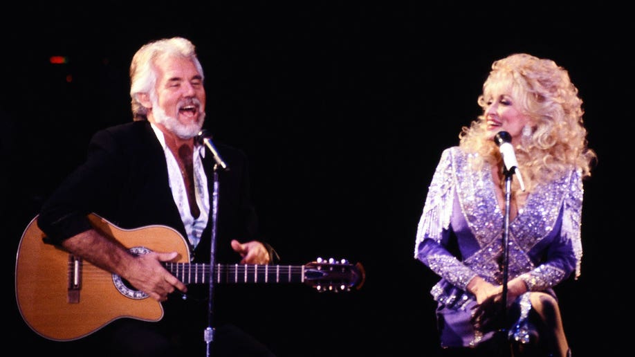 Dolly Parton performing with country singer and friend Kenny Rogers