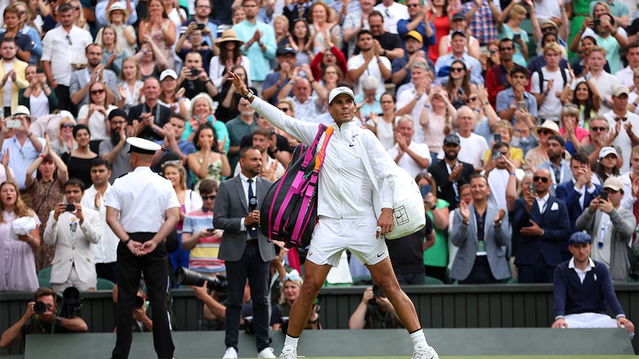 Rafael Nadal salutes crowd following the match