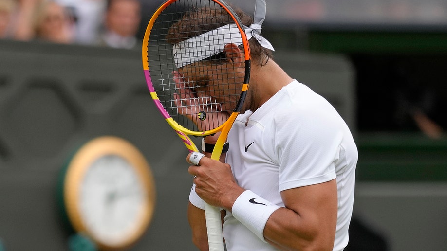 Rafael Nadal wipes the sweat away