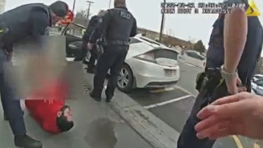 Utah officers detain Sadaat Johnson at a McDonald's in Midvale.