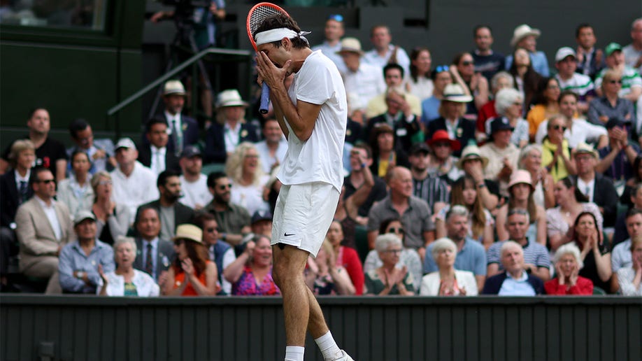 Taylor Fritz reacts after a point against Rafael Nadal
