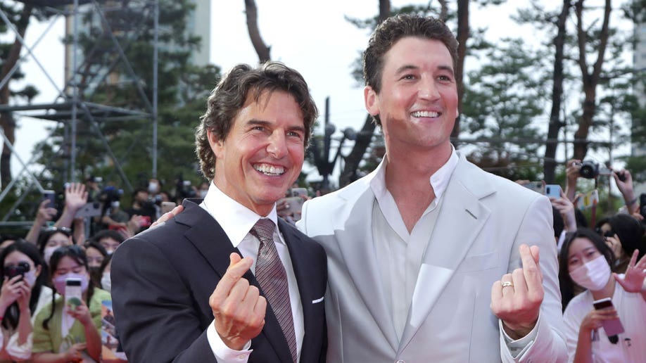 Tom Cruise and Miles Teller