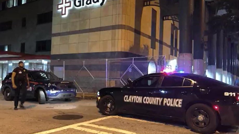 A Clayton County police car in front of a hospital