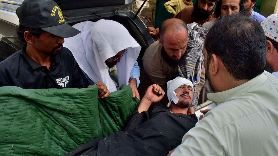 Healthcare workers assist Pakistan bus accident victim