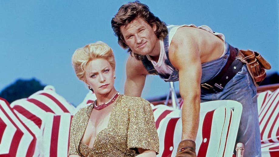 Kurt Russell and Goldie Hawn posing for their movie 