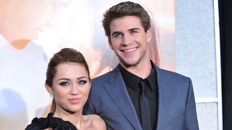 Miley Cyrus and actor Liam Hemsworth at the "The Last Song" premiere together in 2010