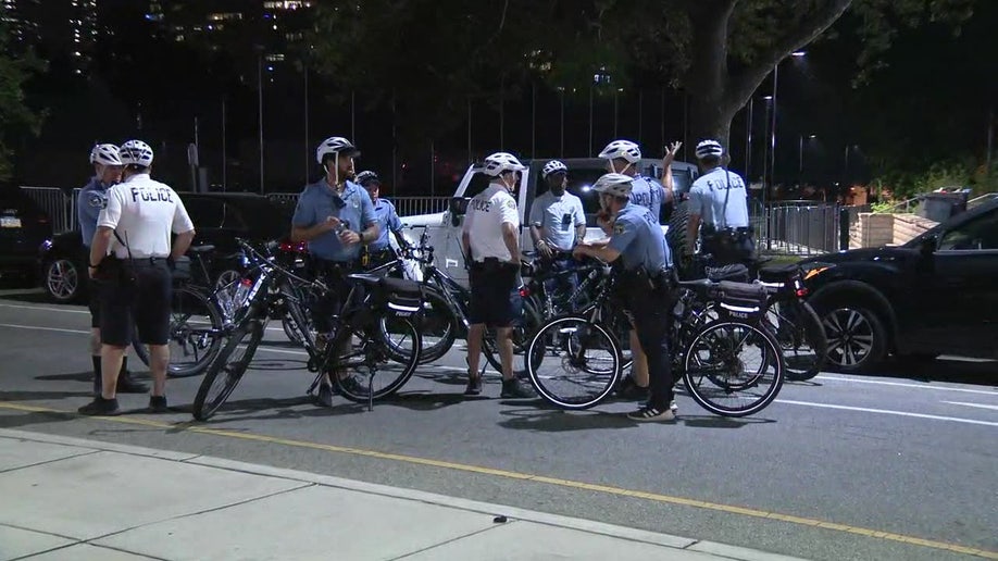 Police on bikes huddled together 