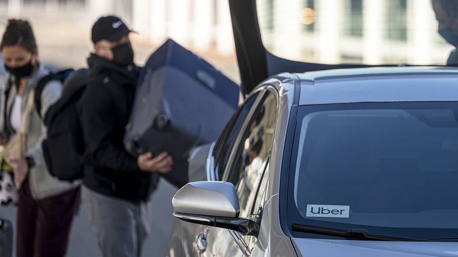Passenger loads box into Uber