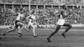 American runner Jesse Owens running in the 200-meter sprint a new Olympic record. Berlin. August 4, 1936.