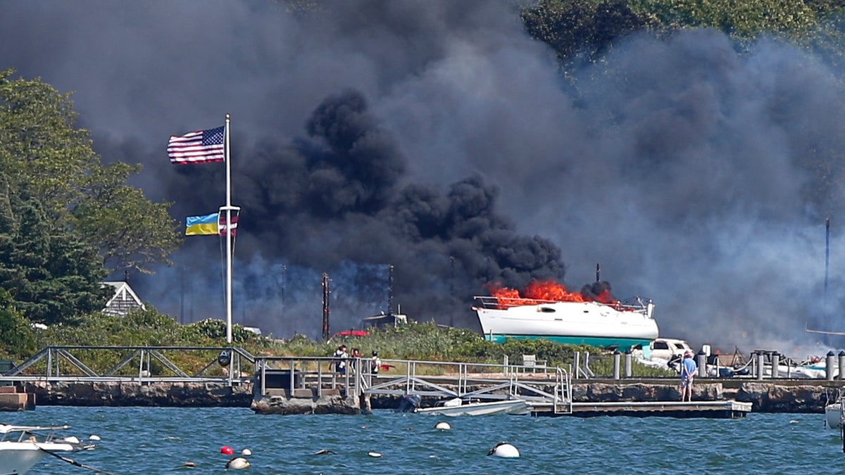 Fire rips through Massachusetts boat yard, black smoke seen for miles