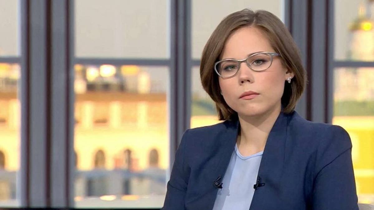 Darya Dugina, daughter of Alexander Dugin, Putin's Brain, in a blue suit