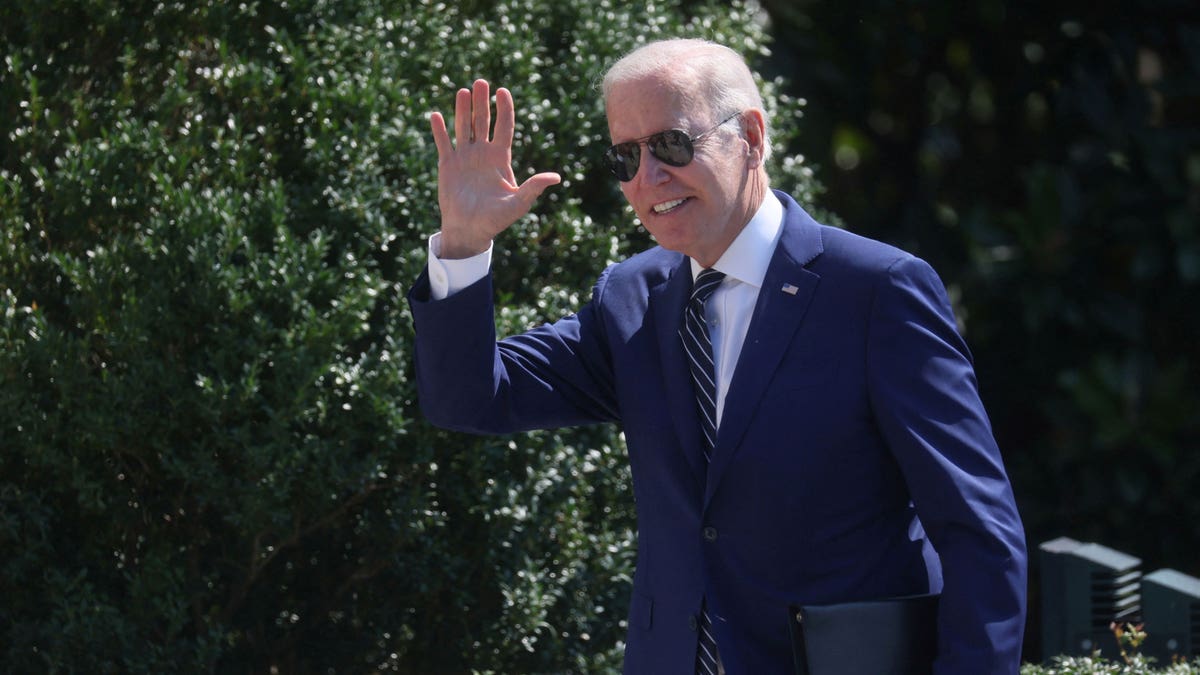 President Joe Biden waving on White House south lawn