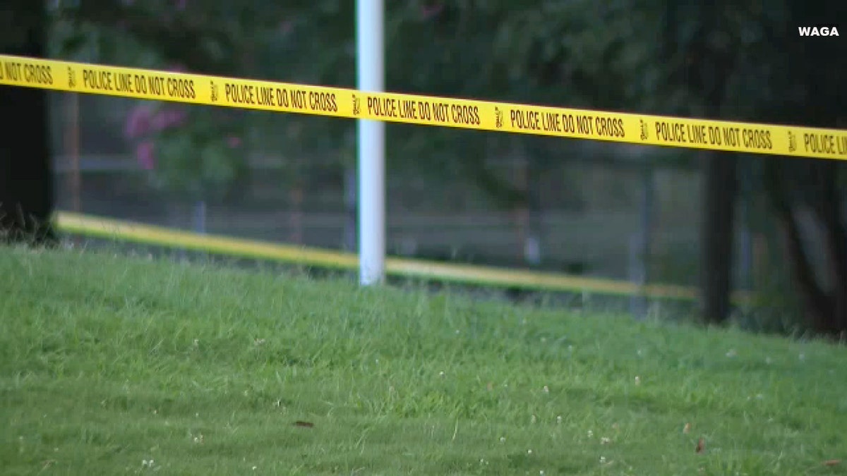 Police tape is seen in an Atlanta park where six people were shot