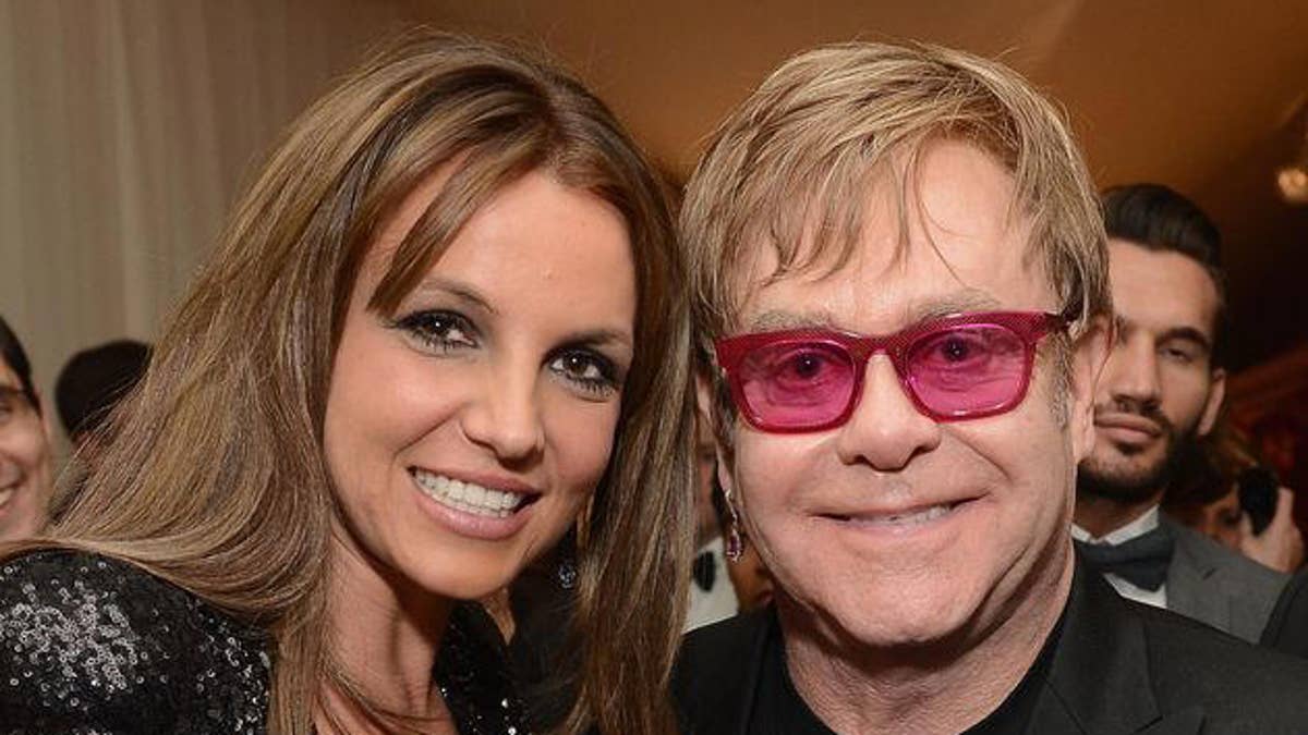 Britney Spears and Elton John smile for a photo