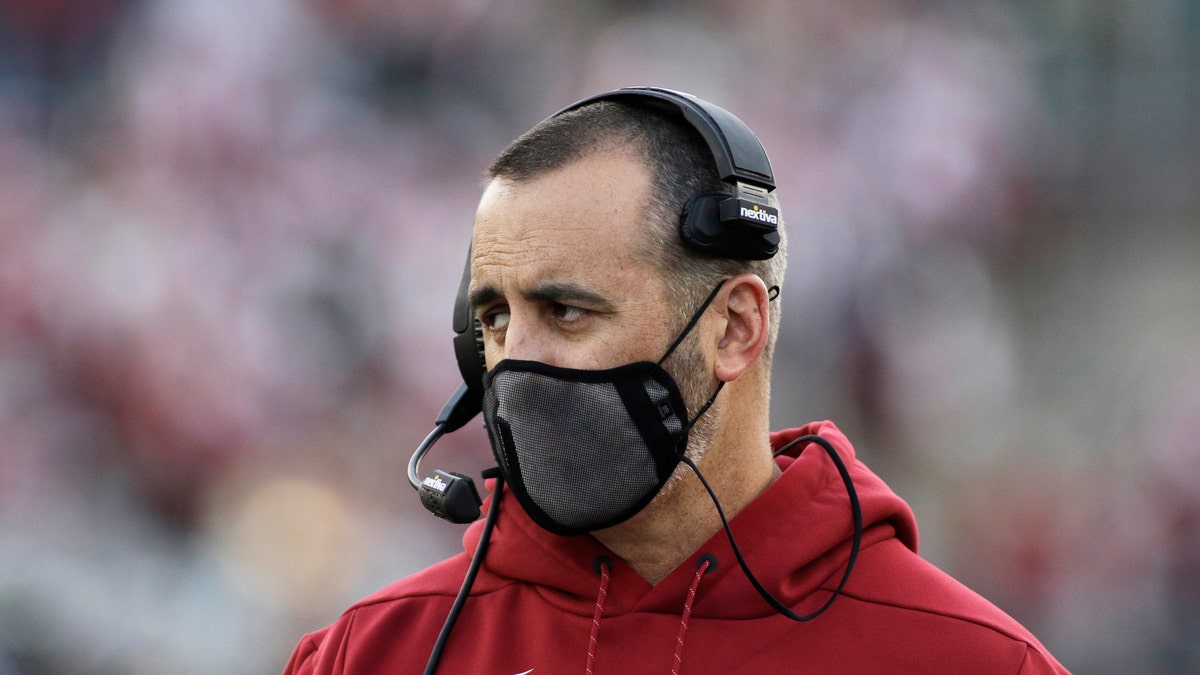Washington State coach Nick Rolovich watches during the first half of an NCAA college football game against Stanford in Pullman, Washington. The former coach filed a claim against the university seeking $25 million for wrongful termination after he was fired last year for refusing to get vaccinated against COVID-19.