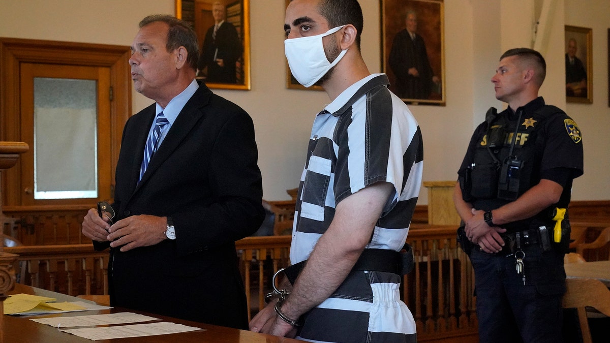 Hadi Matar listens to defense attorney