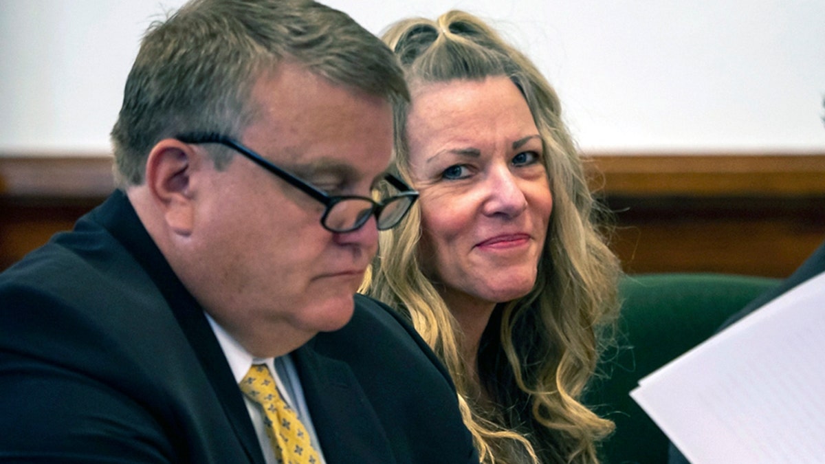 Lori Vallow Daybell, right, sits by an attorney for a hearing at an Idaho courthouse.