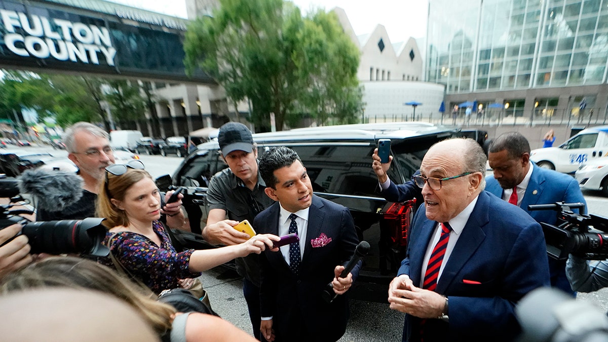 Giuliani with reporters outside Georgia courthouse