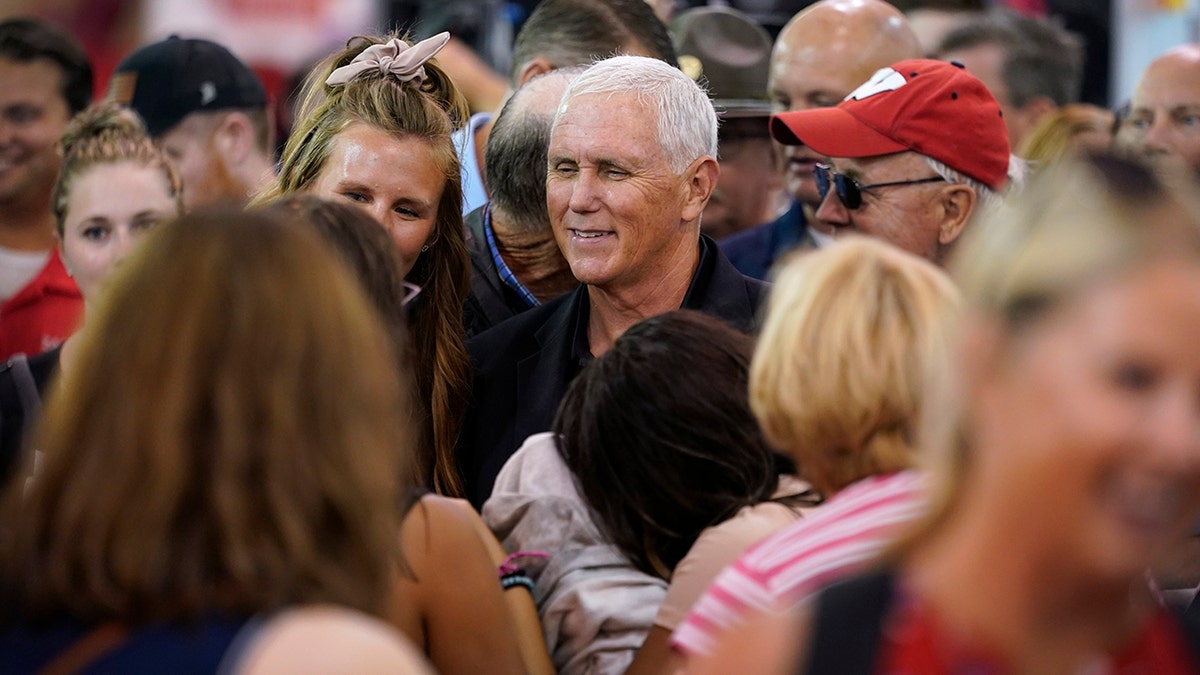 Mike Pence surrounded by supporters