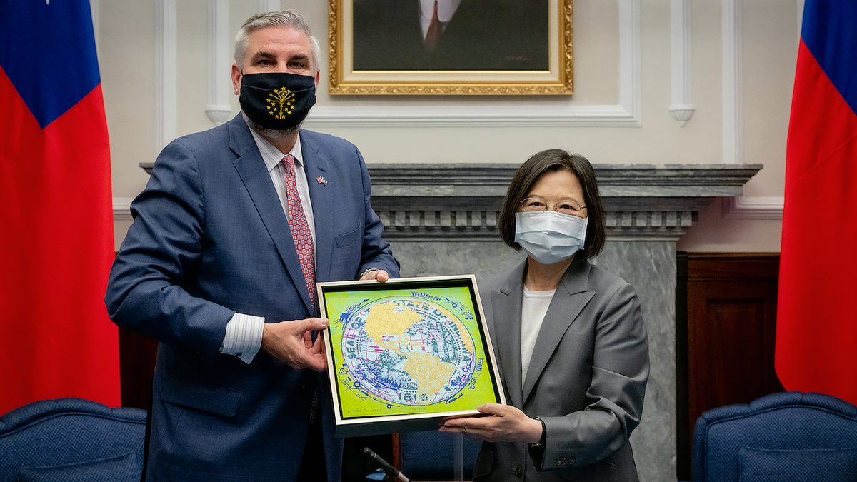 Holcomb standing with Taiwan's president
